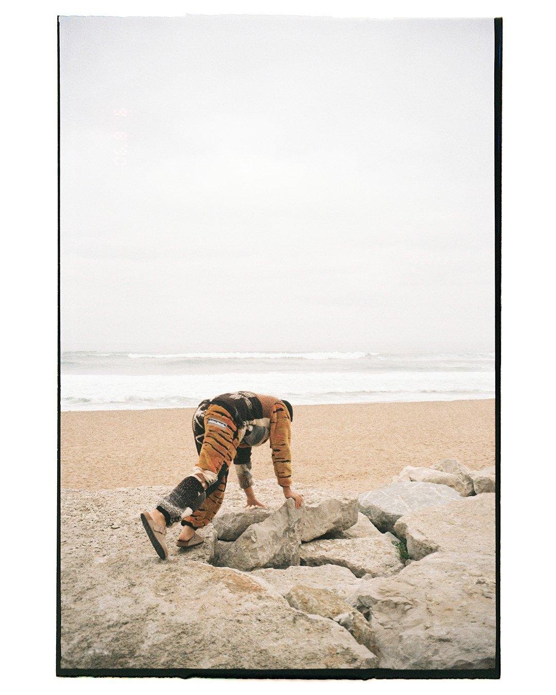 Photo of a guy in the rocks from the Visual installment 8.