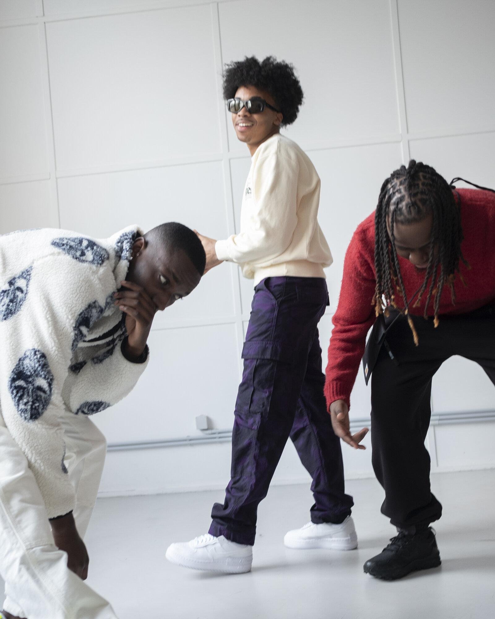 Three models dancing for Visual Instalment 4.