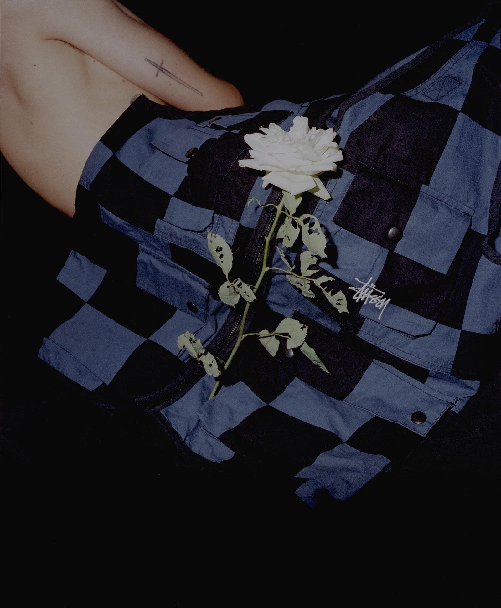 A white rose over a Stussy shirt for Visual Installment 1.