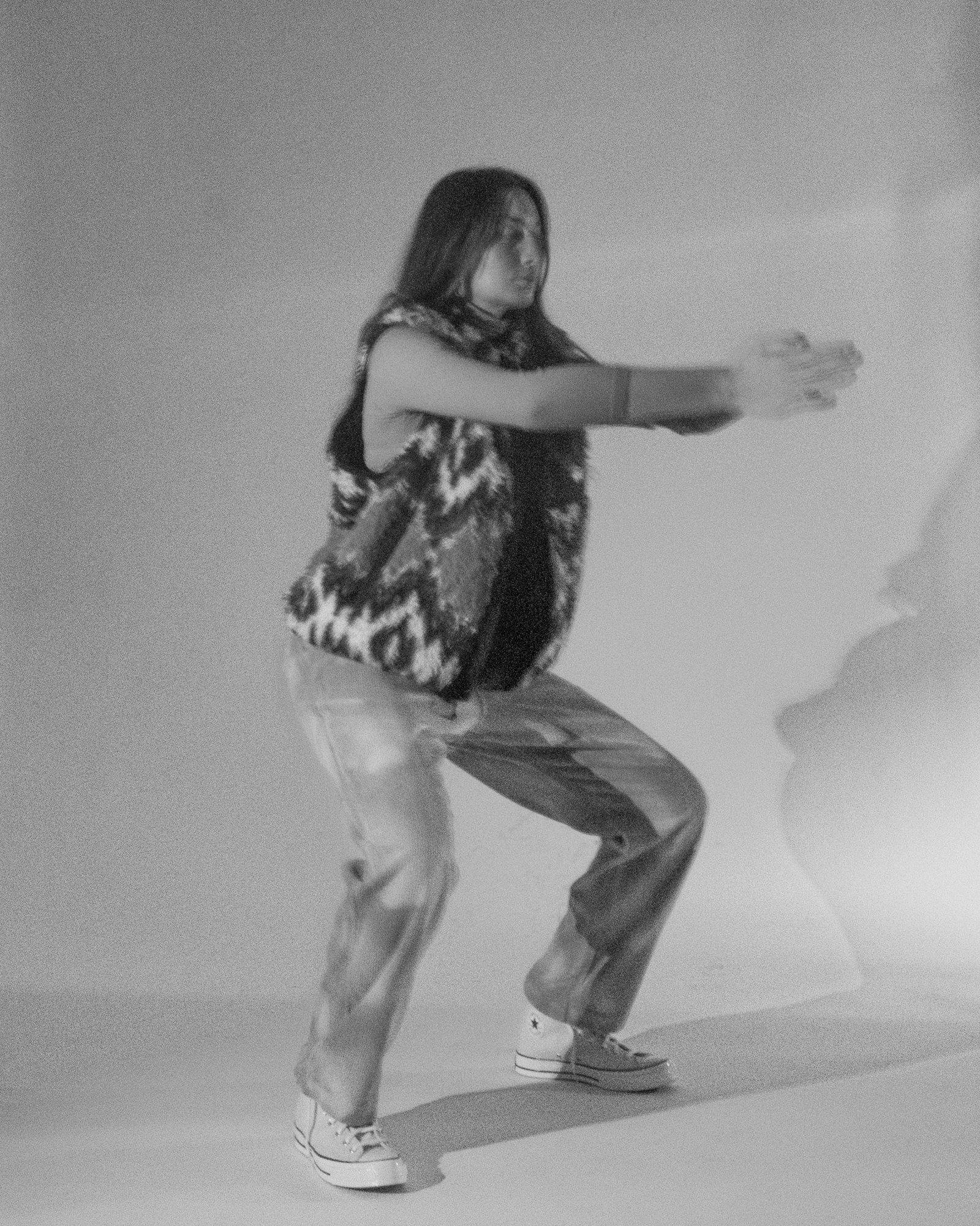 Model posing for Visual Instalment 9 in black and white.