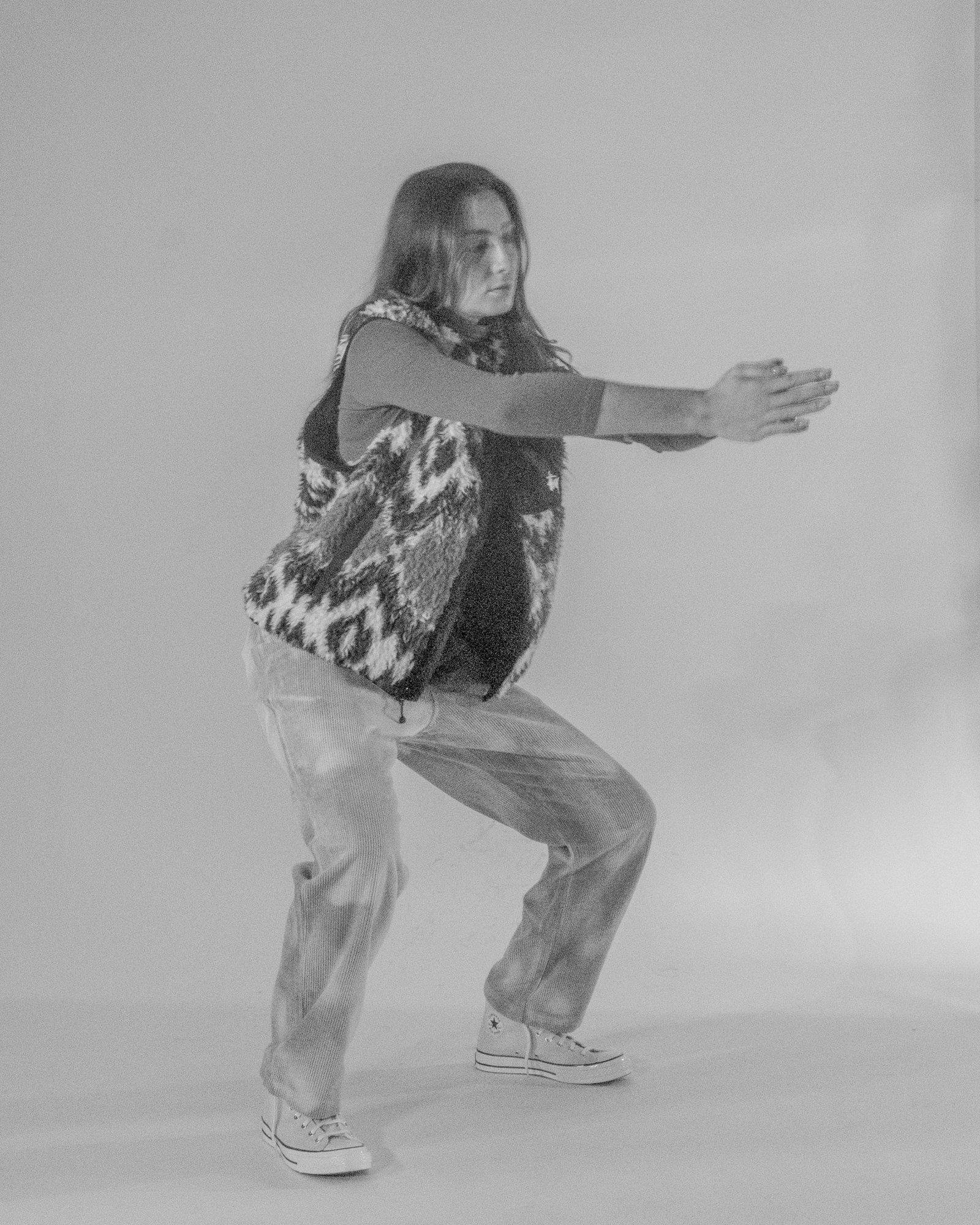 Model posing for Visual Instalment 9 in black and white.
