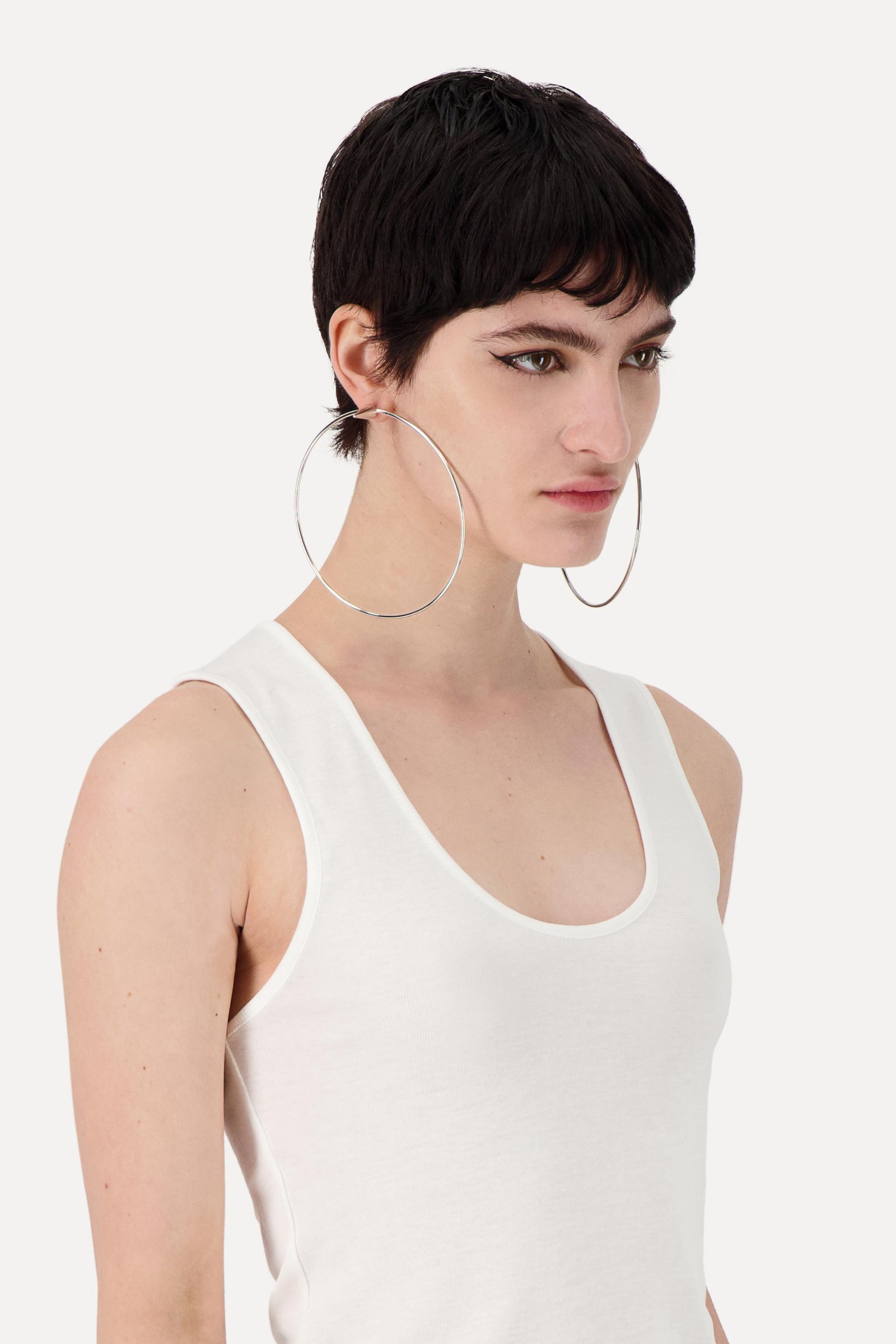 Side view of a person wearing the Justine Clenquet Sofia Earrings.