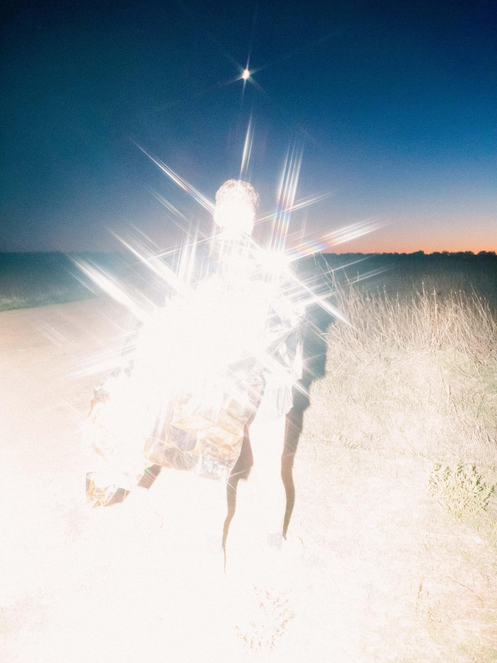 A model shining in the beach for Visual Instalment 12.
