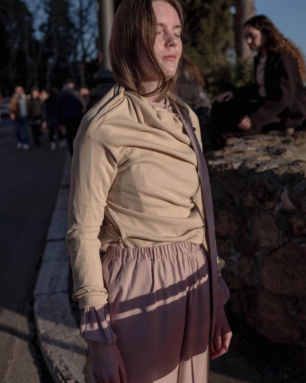 Model wearing the Baserange Tav Turtleneck from the side