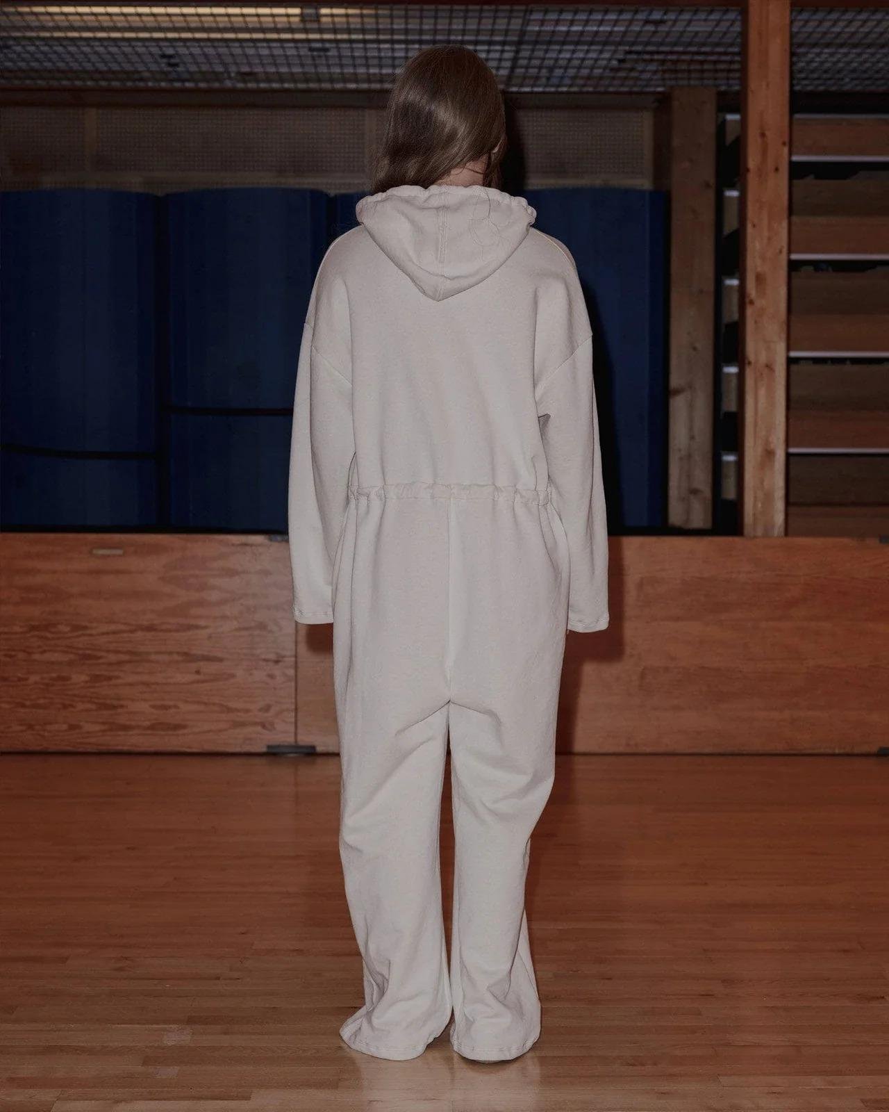 Model wearing the Baserange Ordu Jumpsuit Off-White from the back.