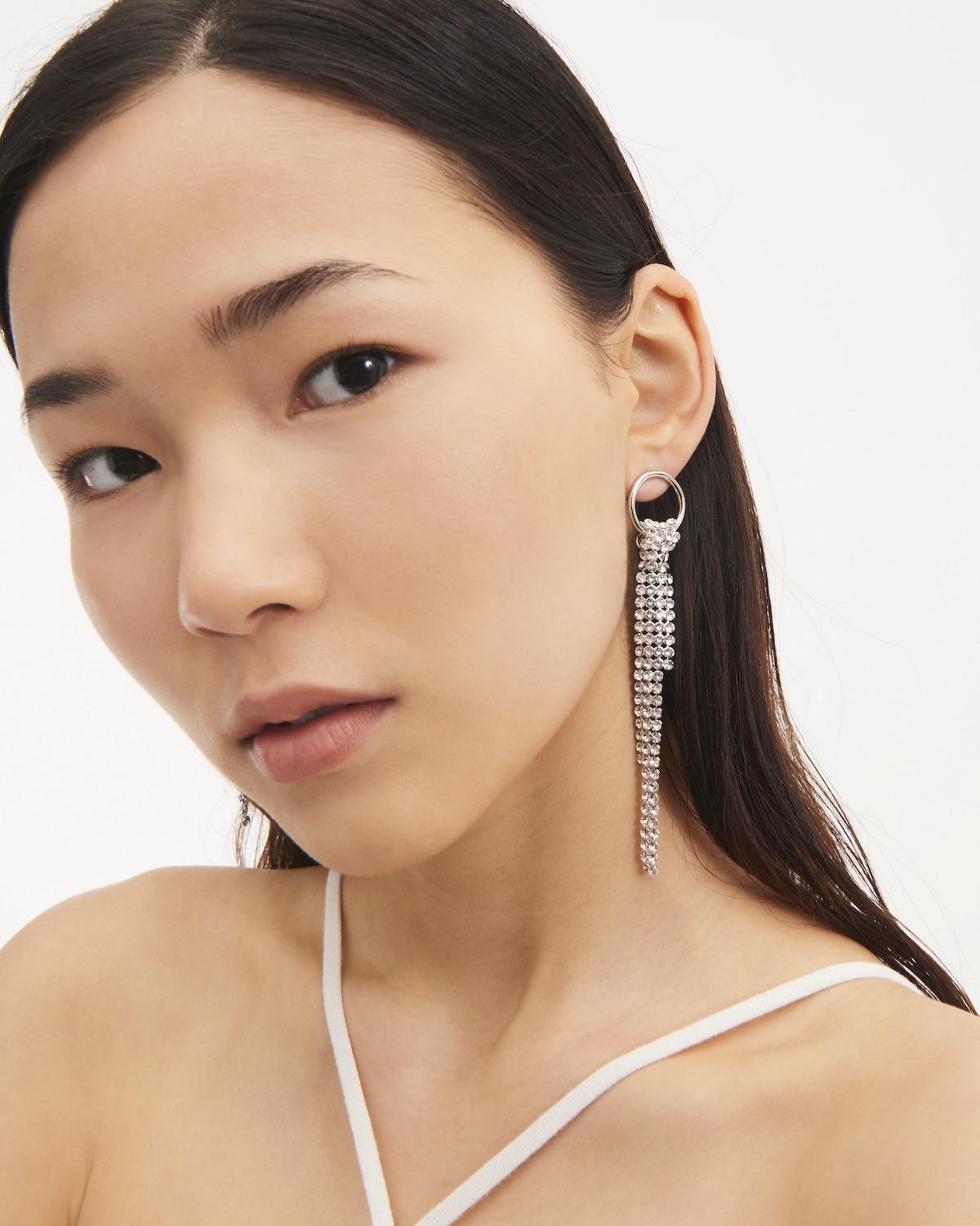 Side view of a person wearing the Justine Clenquet Shanon Earrings.