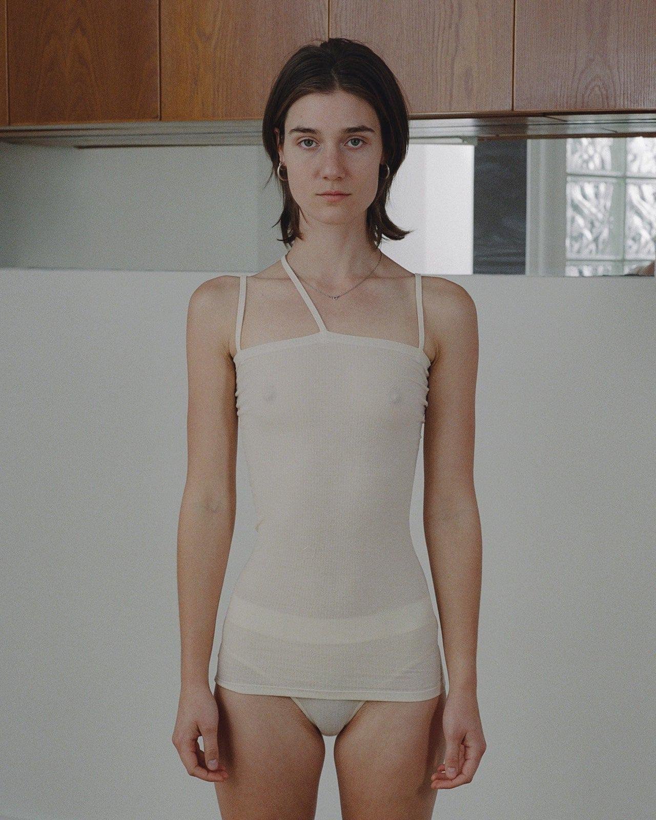 View of a person wearing the Baserange Nida Tank Top from the front.