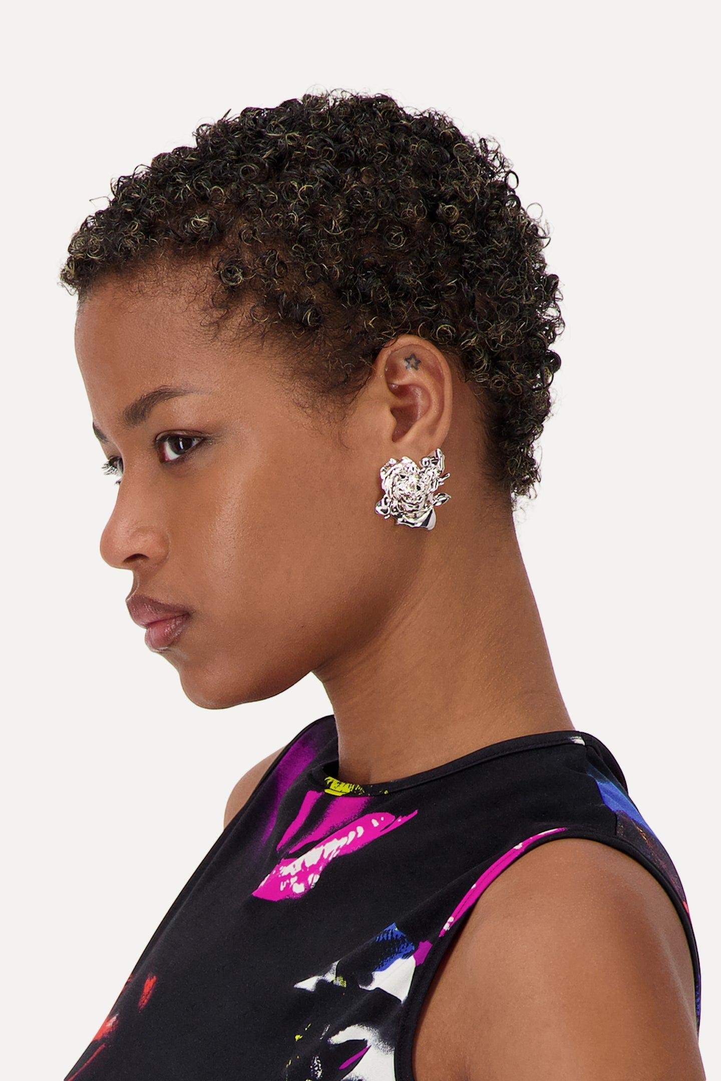 A Person wearing the Justine Clenquet Juliet Earrings