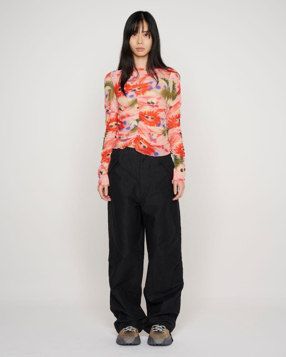 Model wearing Brain Dead Fuzzy Friends Ruched Hyper Mesh Top