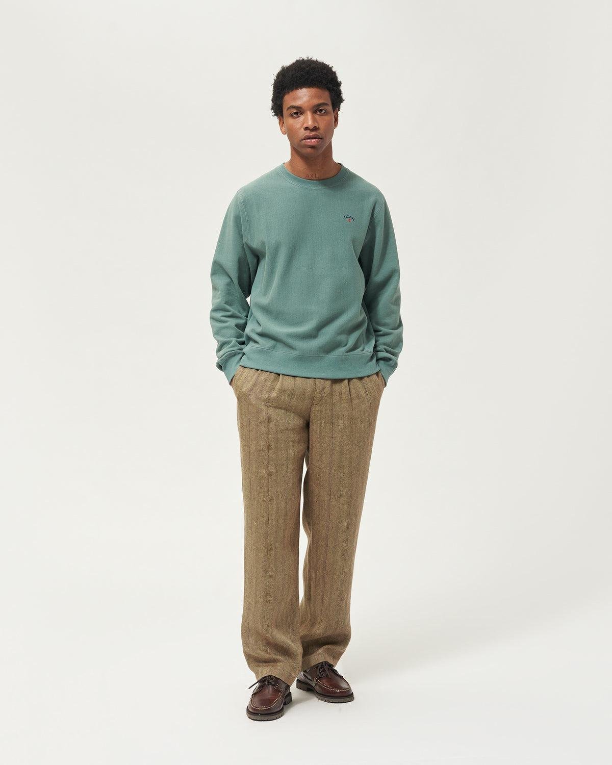 Model wearing the Detail of the Noah Classic Crewneck