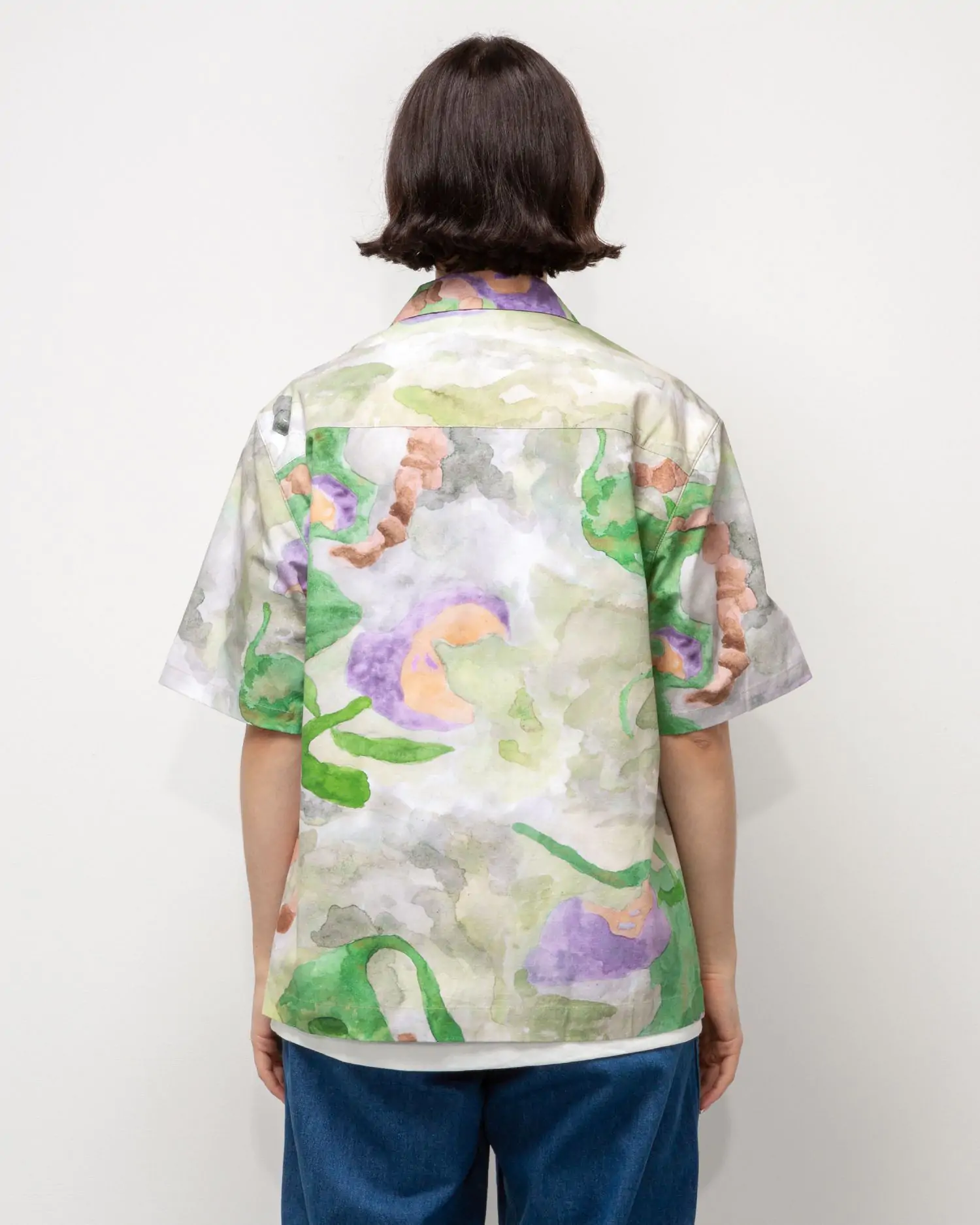 View of a person wearing the Heresy Annelida Shirt from the back.