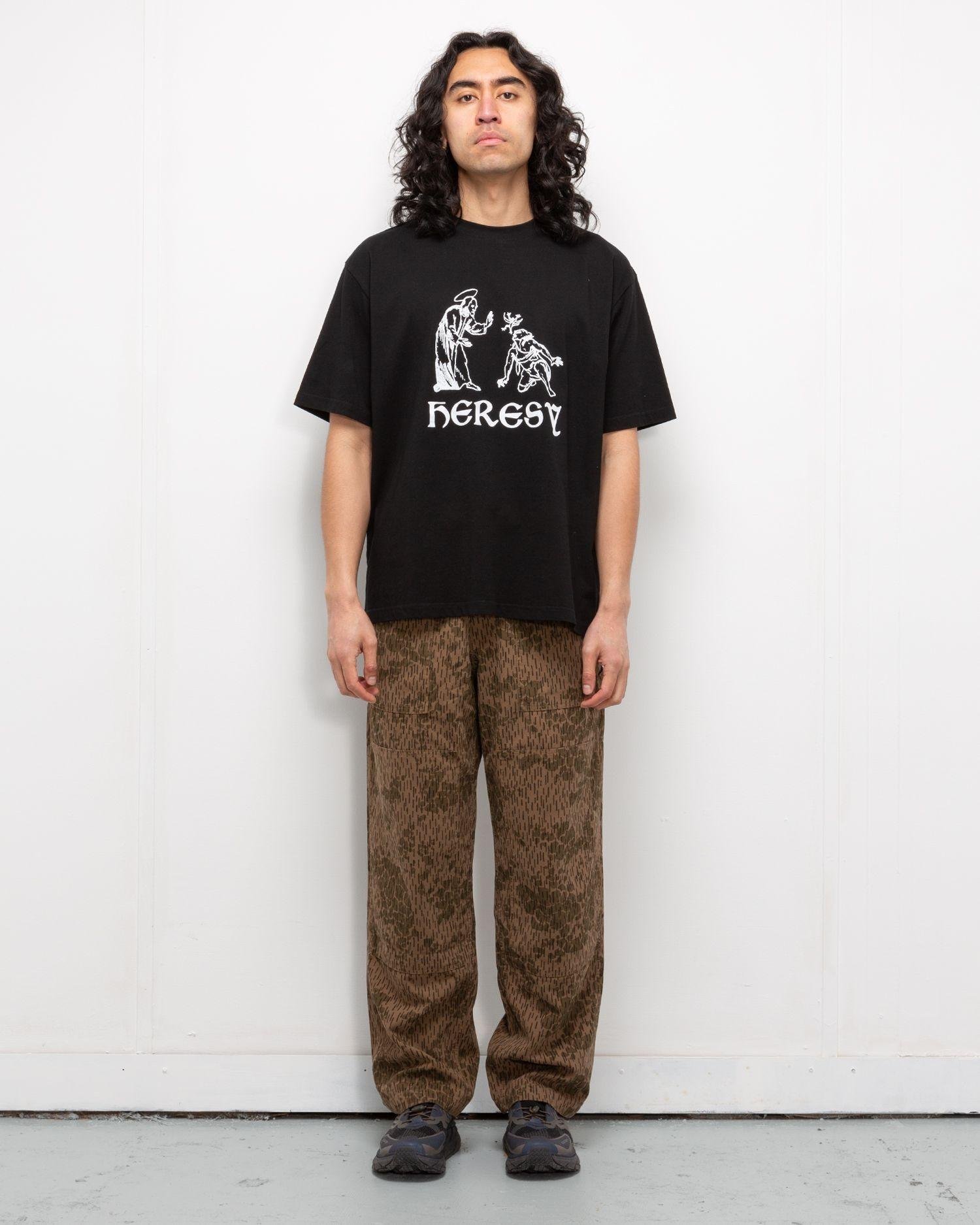 Person wearing the Heresy Drencher Trousers from the front.