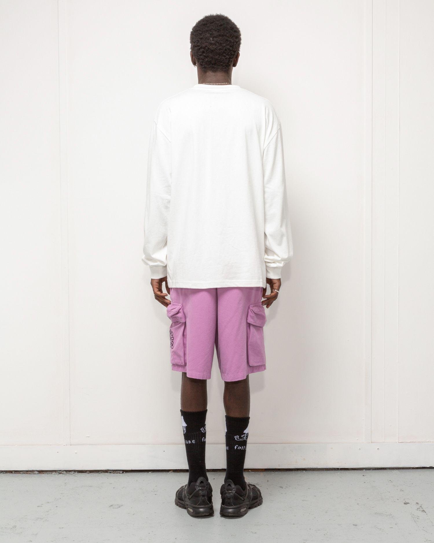 Person wearing the Heresy Excursion Shorts from the back.