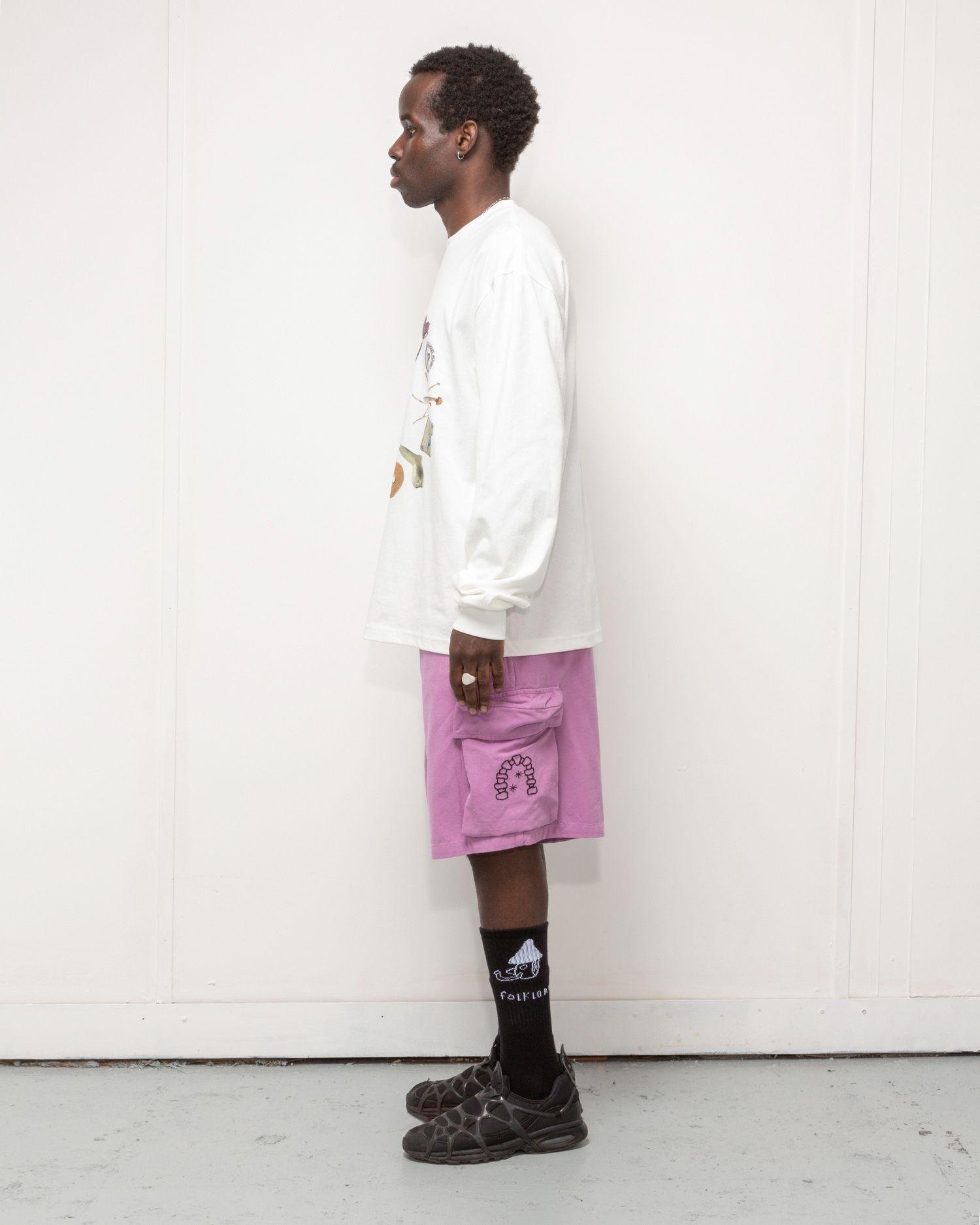 Person wearing the Heresy Excursion Shorts from the side.