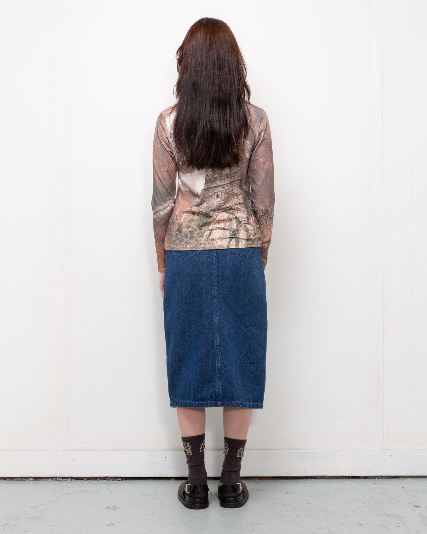 Person wearing the Heresy Ruins Top from the back.