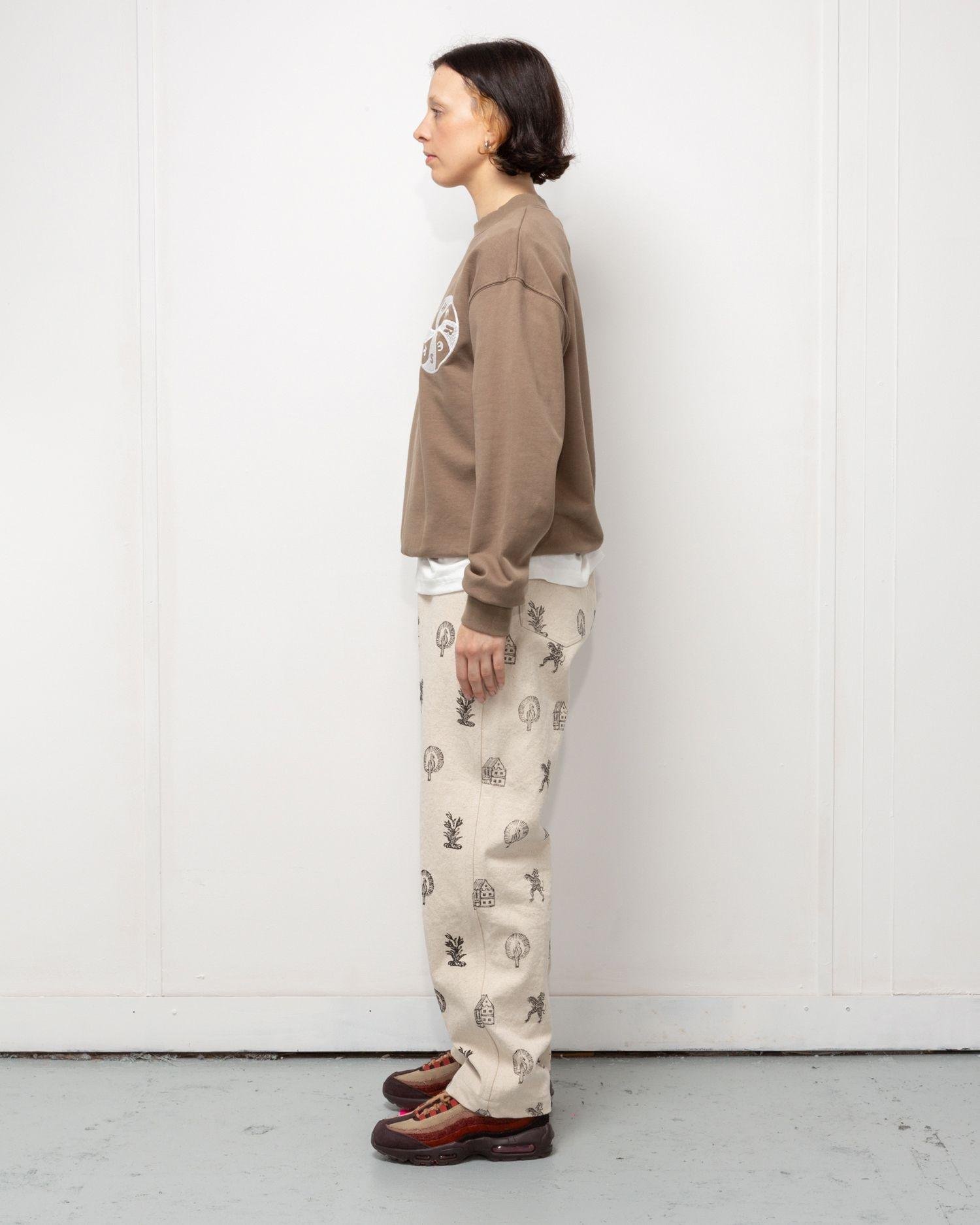 Person wearing the Heresy Woodcut Jeans from the side.