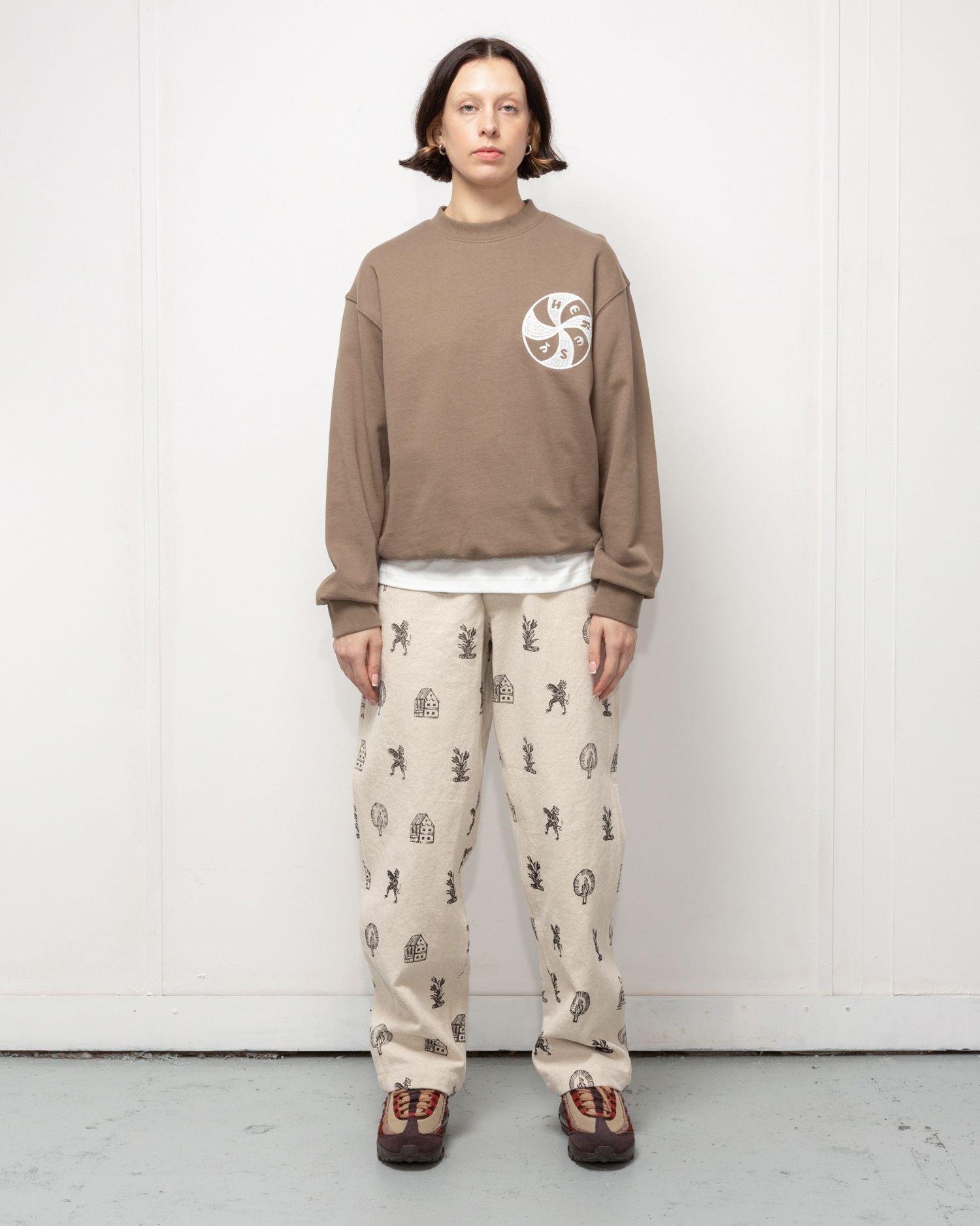 Person wearing the Heresy Woodcut Jeans from the front.