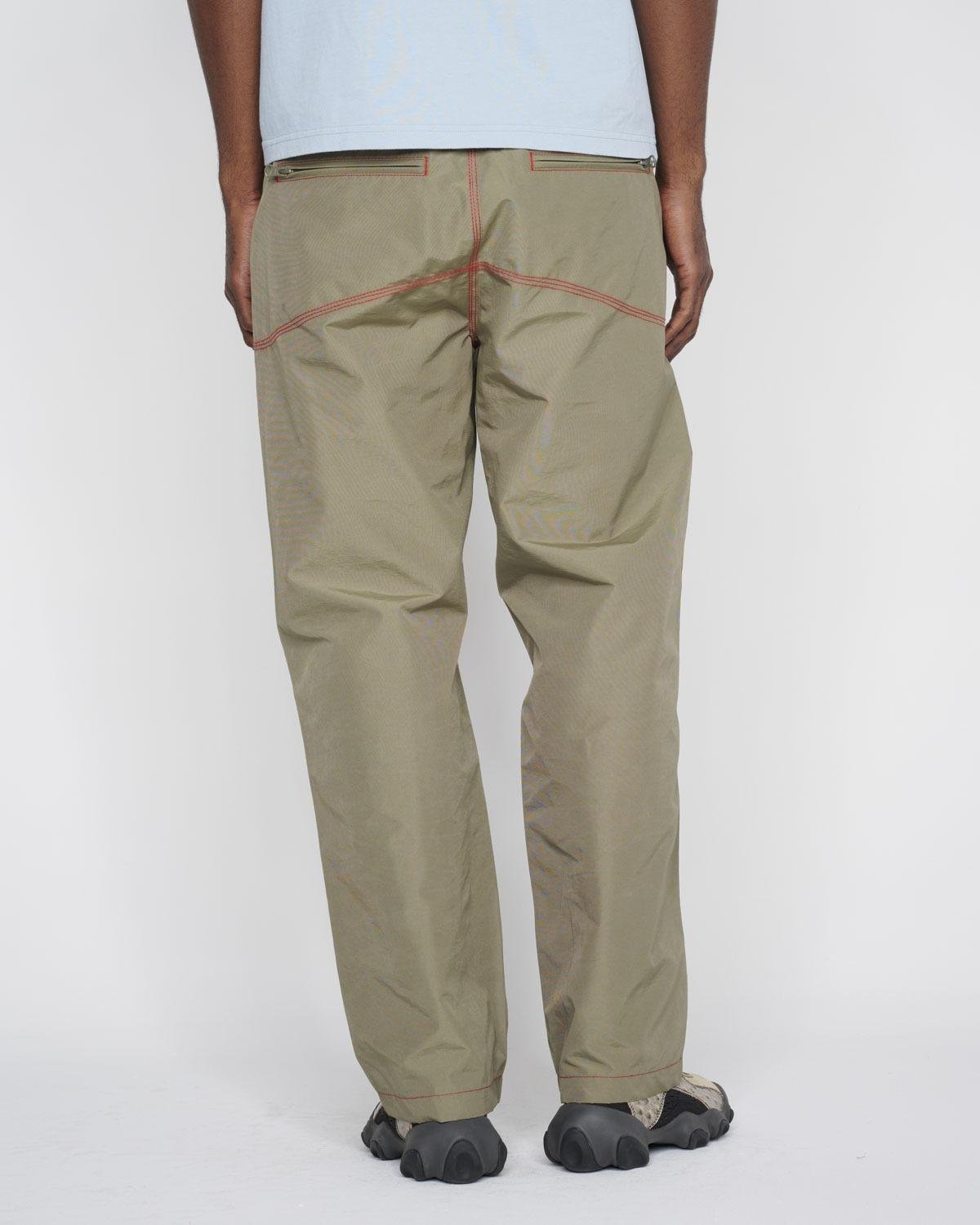 male model wearing the Brain Dead Triple Needle Bishop Pant