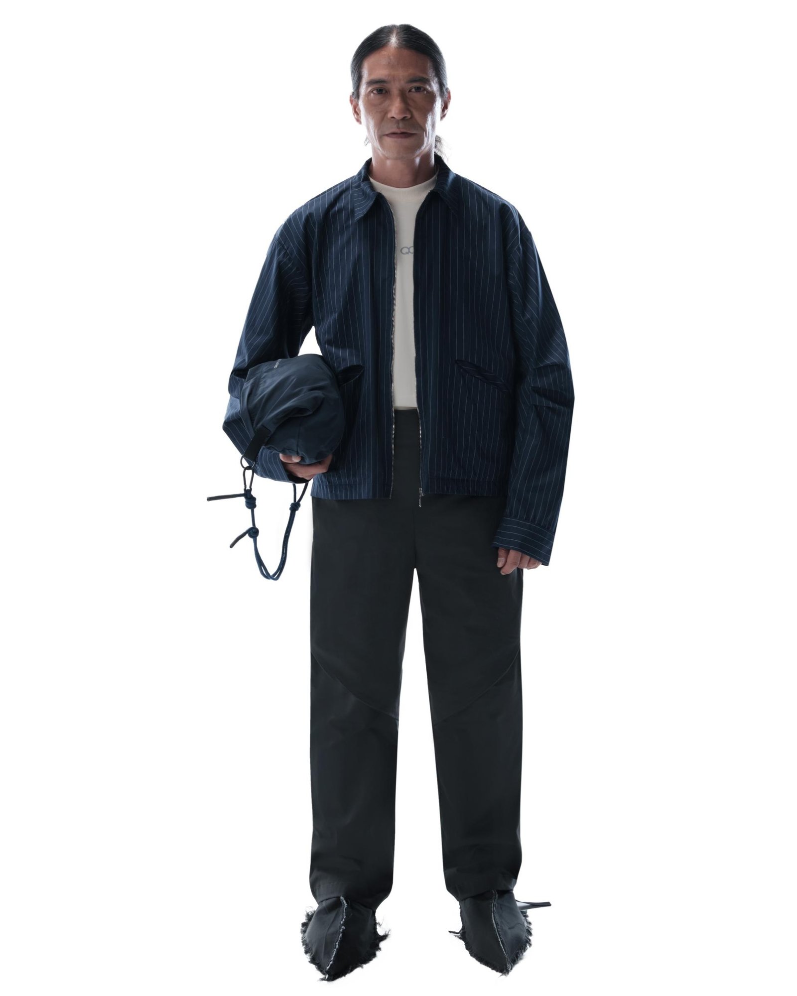 View from the front of a person wearing the Flamel Pants in Dark Grey.