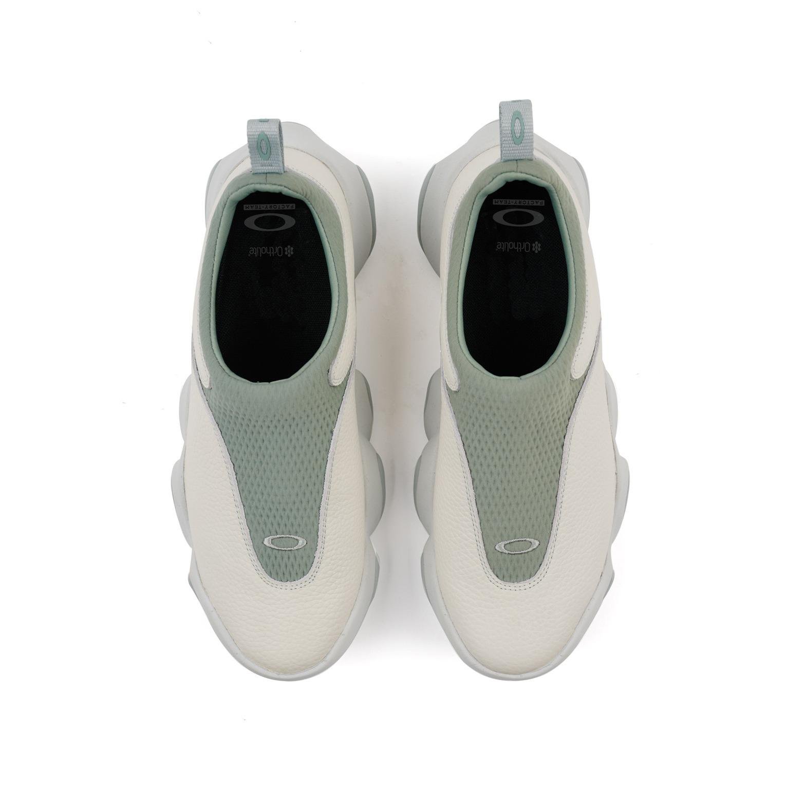 A pair of Oakley Factory Team Flesh Suede – Lily Pad from above