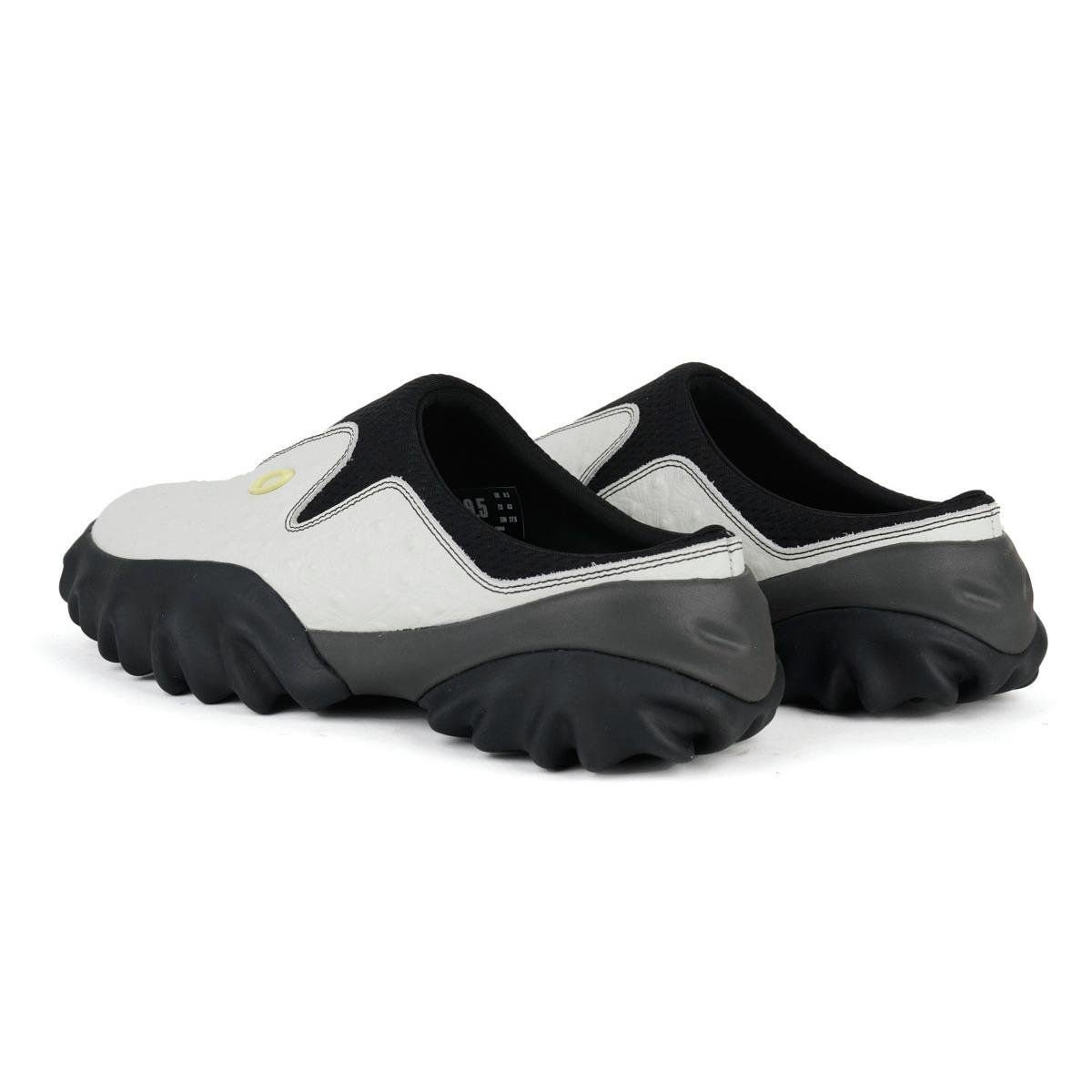 A pair of Oakley Factory Team Chop Saw Mule – Ostrich White from behind