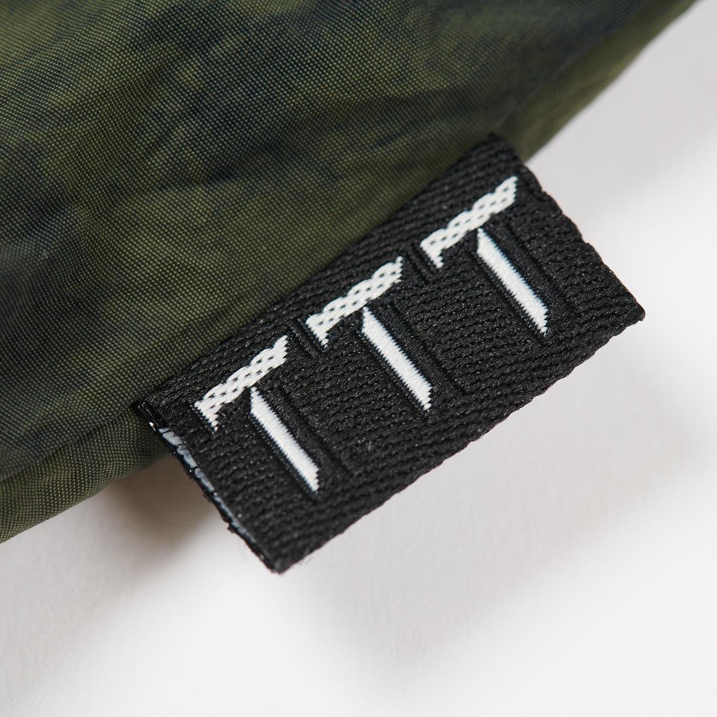 The Trilogy Tapes Tech Sports Crewneck label detail.