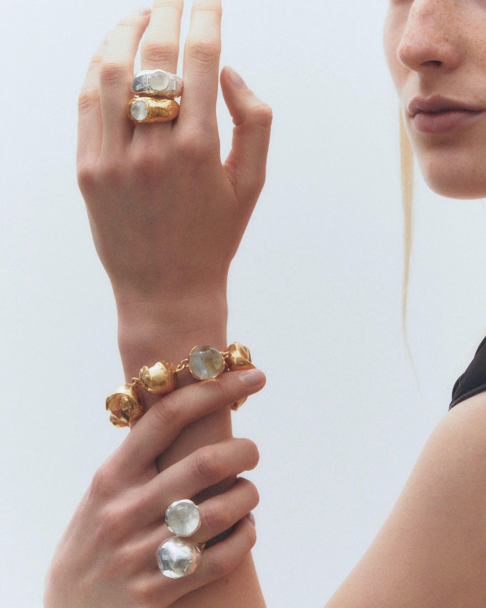 Model wearing several Simuero jewelry.