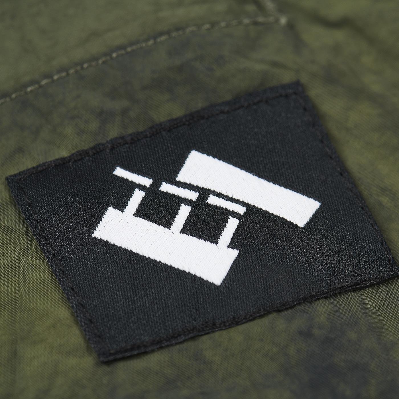 The Trilogy Tapes Tech Beach Pants label detail.