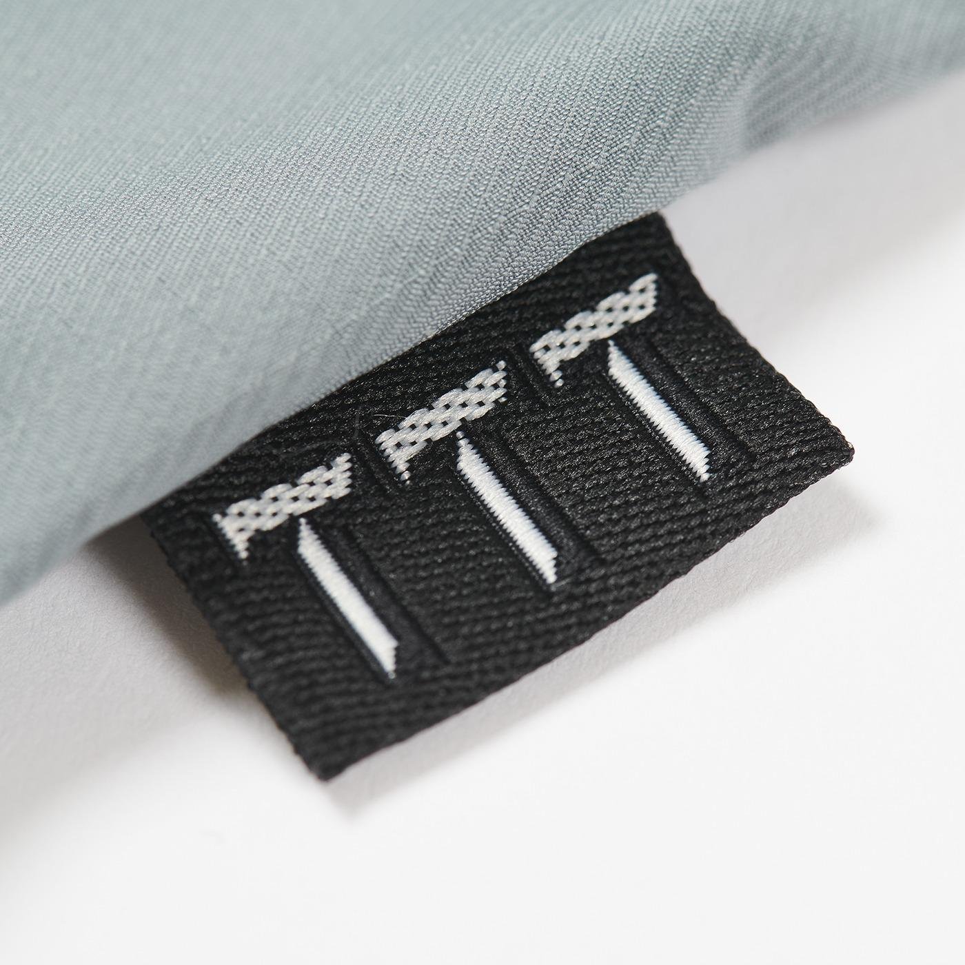 The Trilogy Tapes Ripstop Packable Jacket case label.