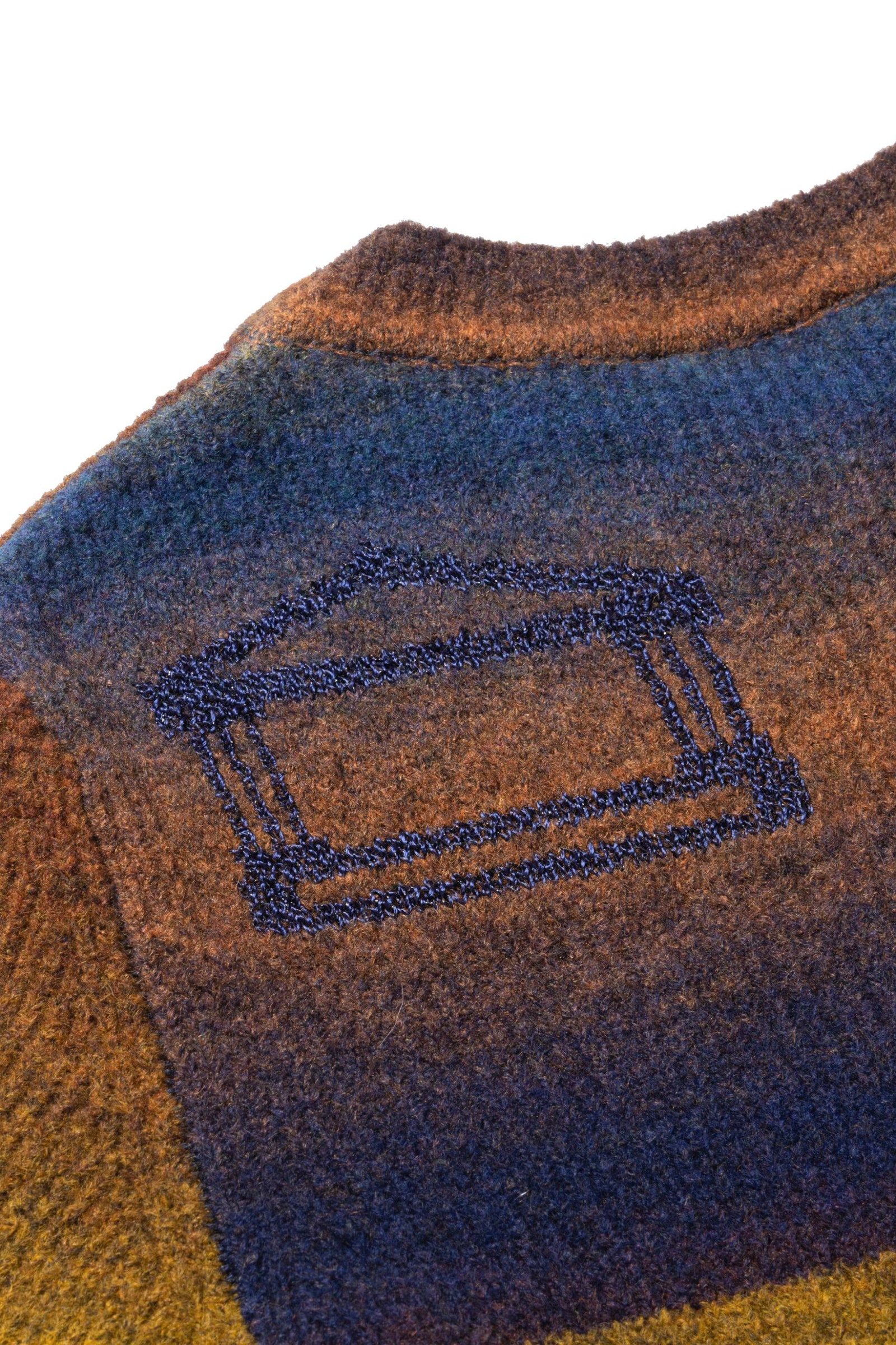 Aries Boucle Space Dye Holey Dress logo shoulder detail.