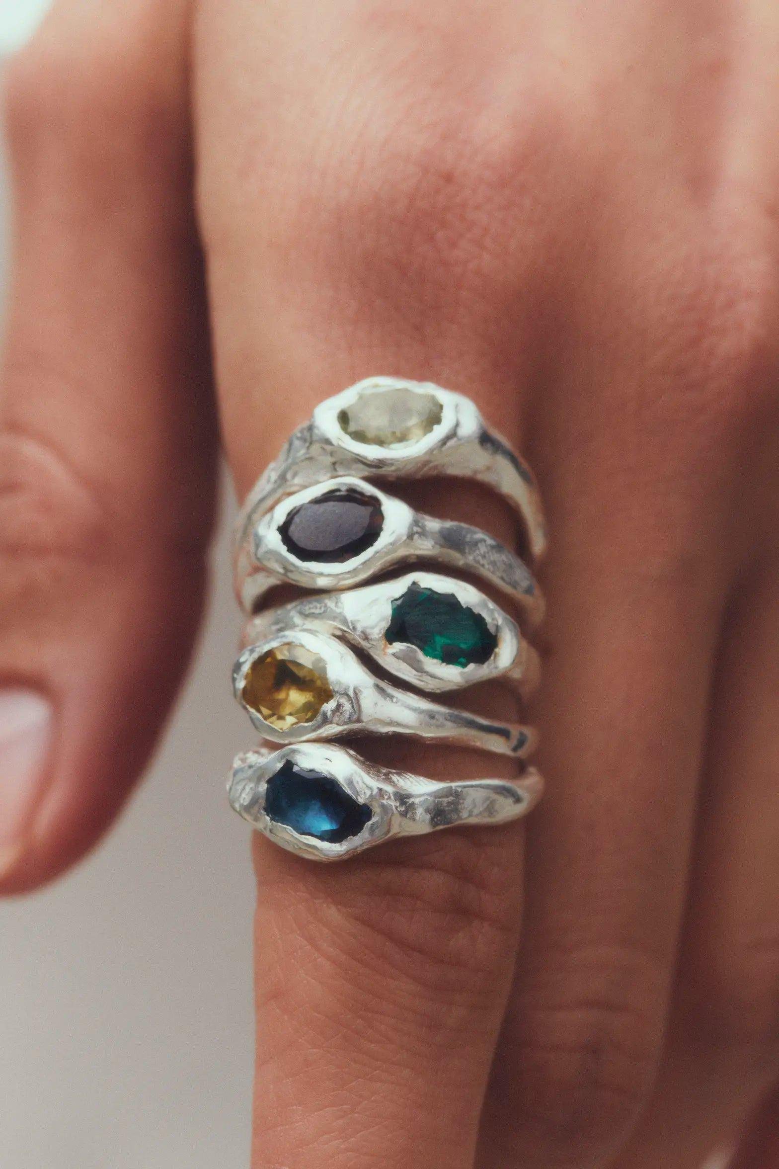 Several Simuero Faro Rings in Silver in one finger.