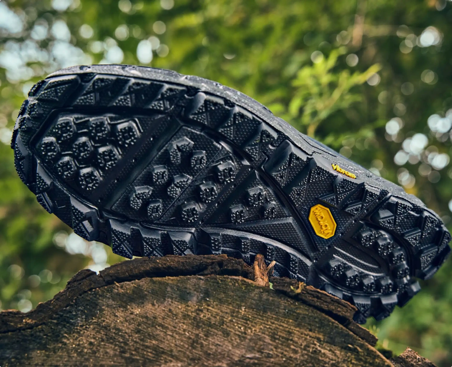 Hoka Tor Summit Black bottom view in a white background