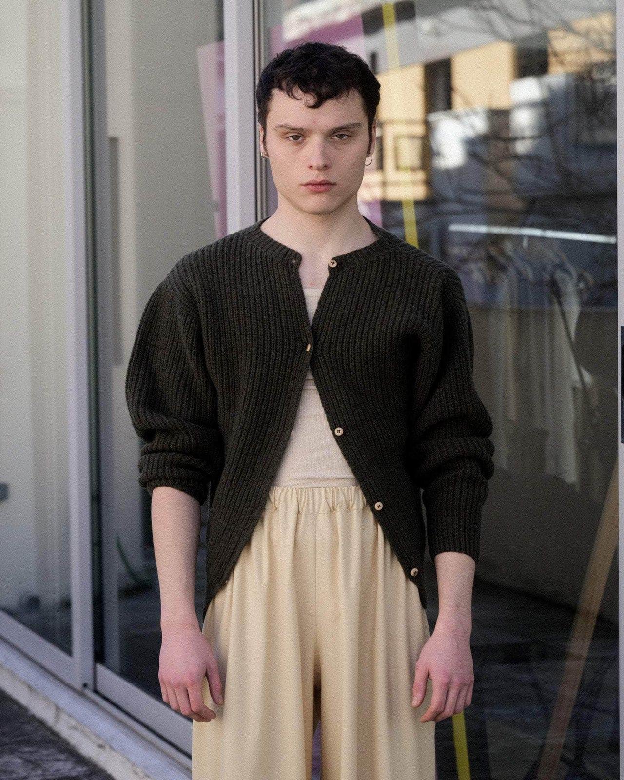 Person wearing the Baserange Mea Cardigan from the front.