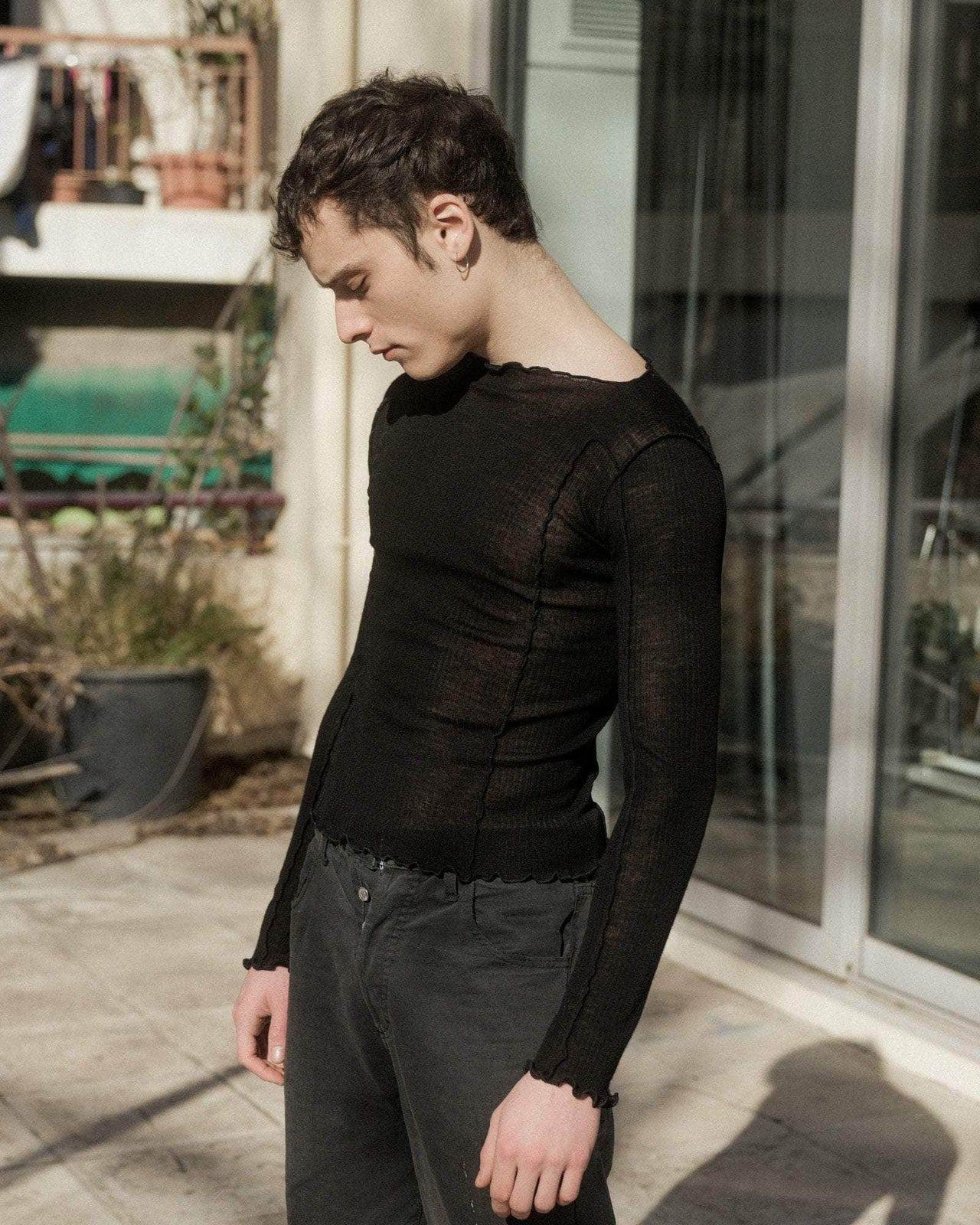 Person wearing the Baserange Omato Long Sleeve from the side.