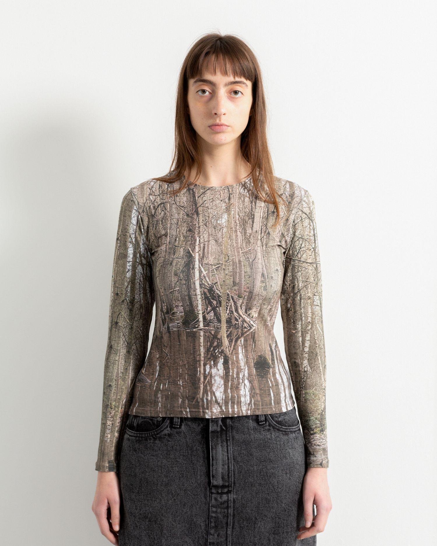 View of a person wearing the Heresy Marsh Top Print from the front.