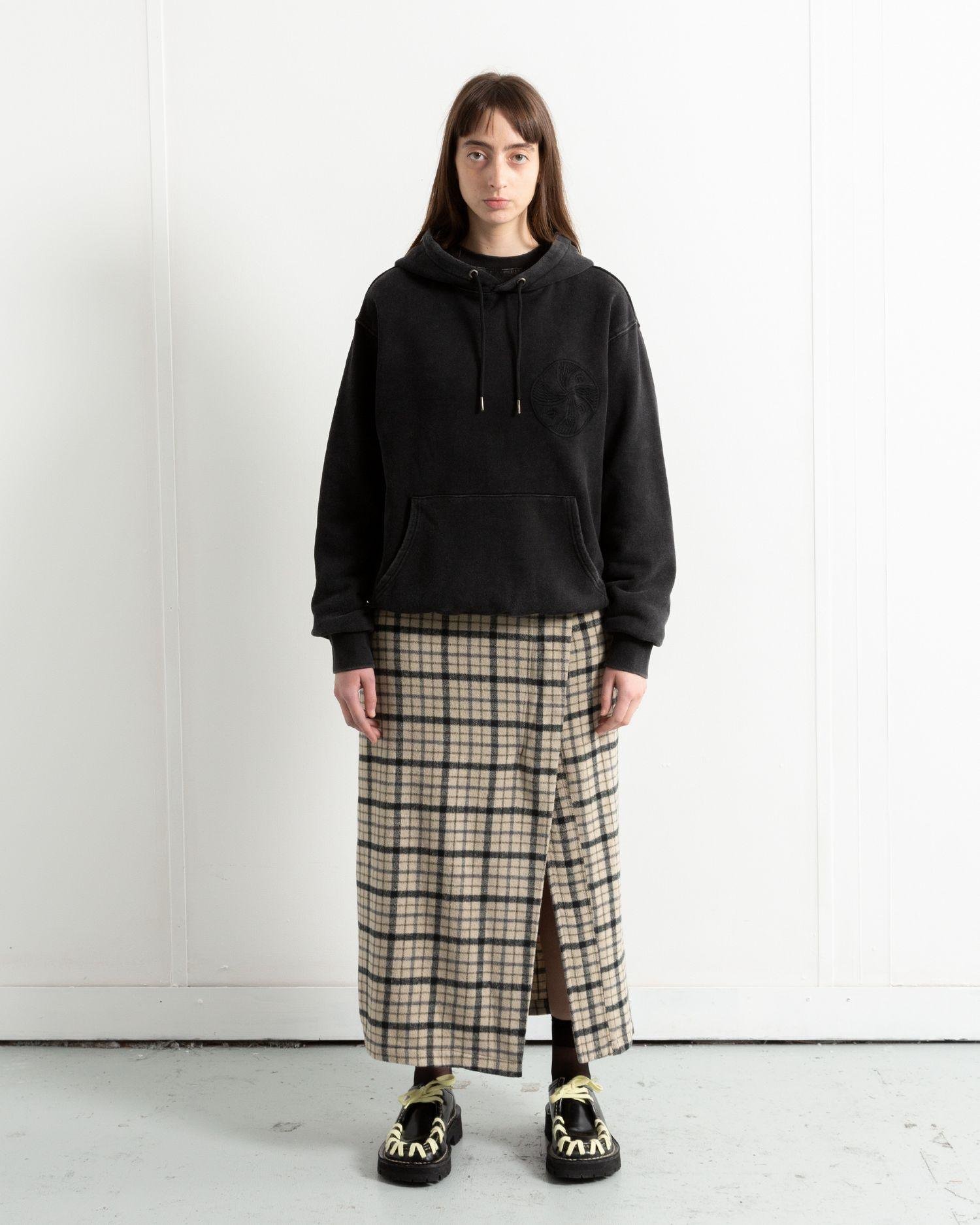 A person wearing the Heresy Steady Skirt from the front.