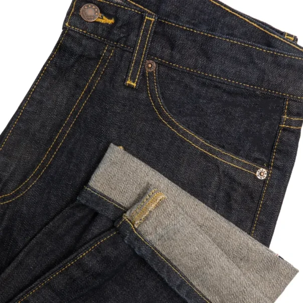 Noah 5-Pocket Denim Jeans Indigo hem detail in a white background