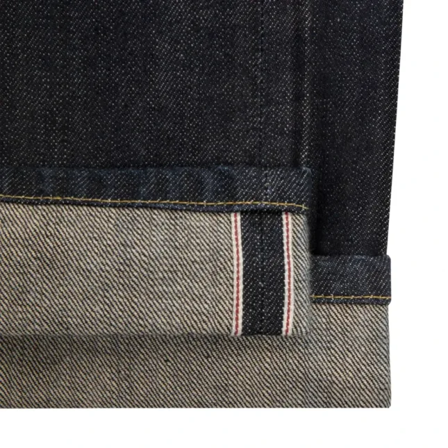 Noah 5-Pocket Denim Jeans Indigo hem detail in a white background