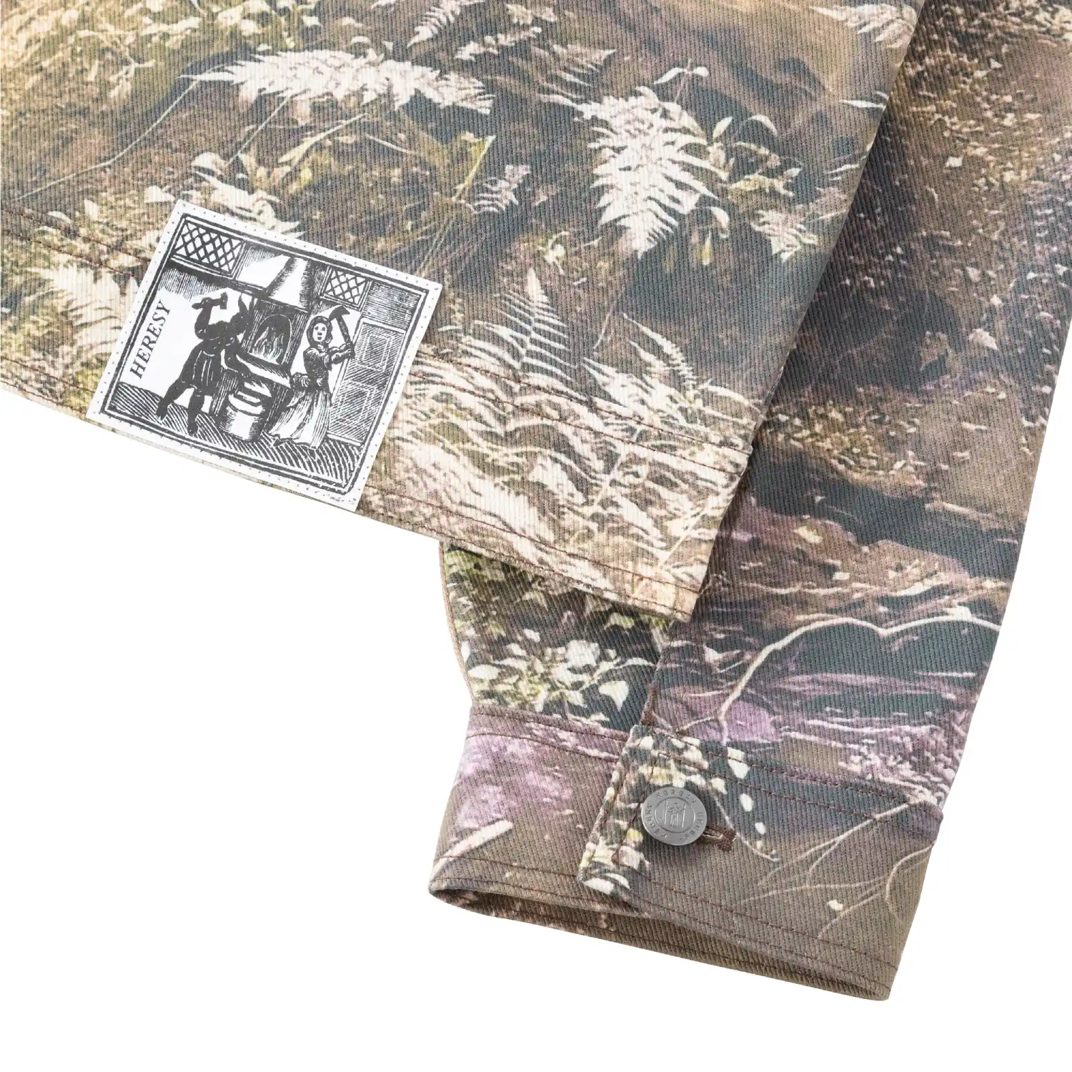 Heresy Dunino Jacket back view patch detail in a white background