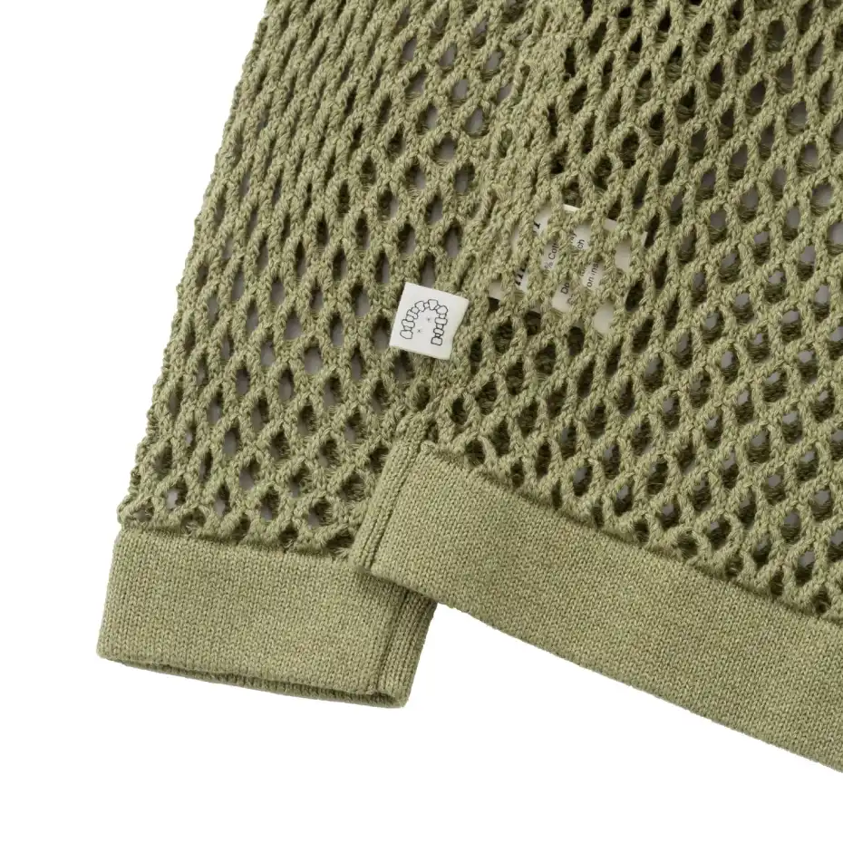 Heresy Skein Crew cuff detail in a white background