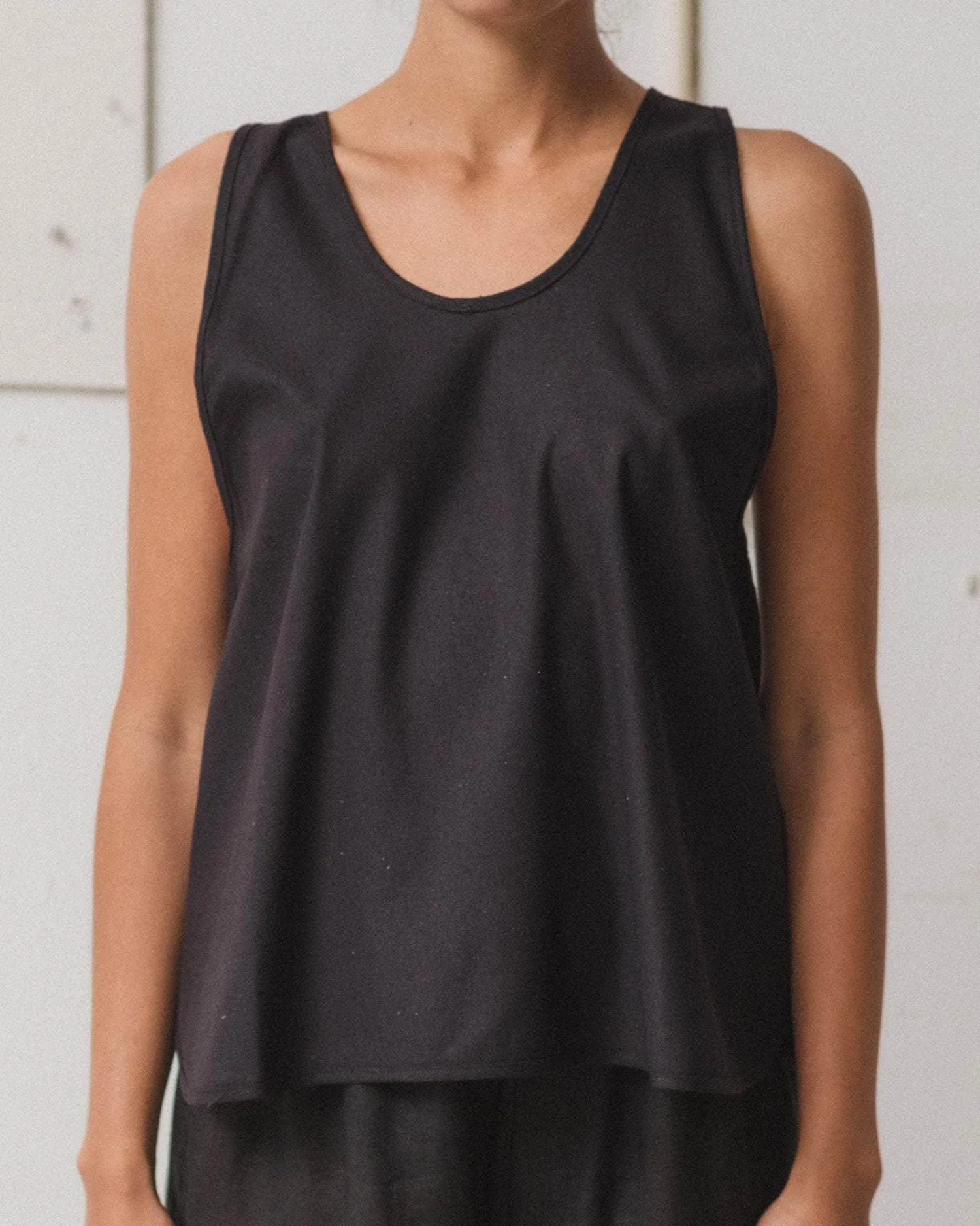 Baserange Apron Top Black front view on model