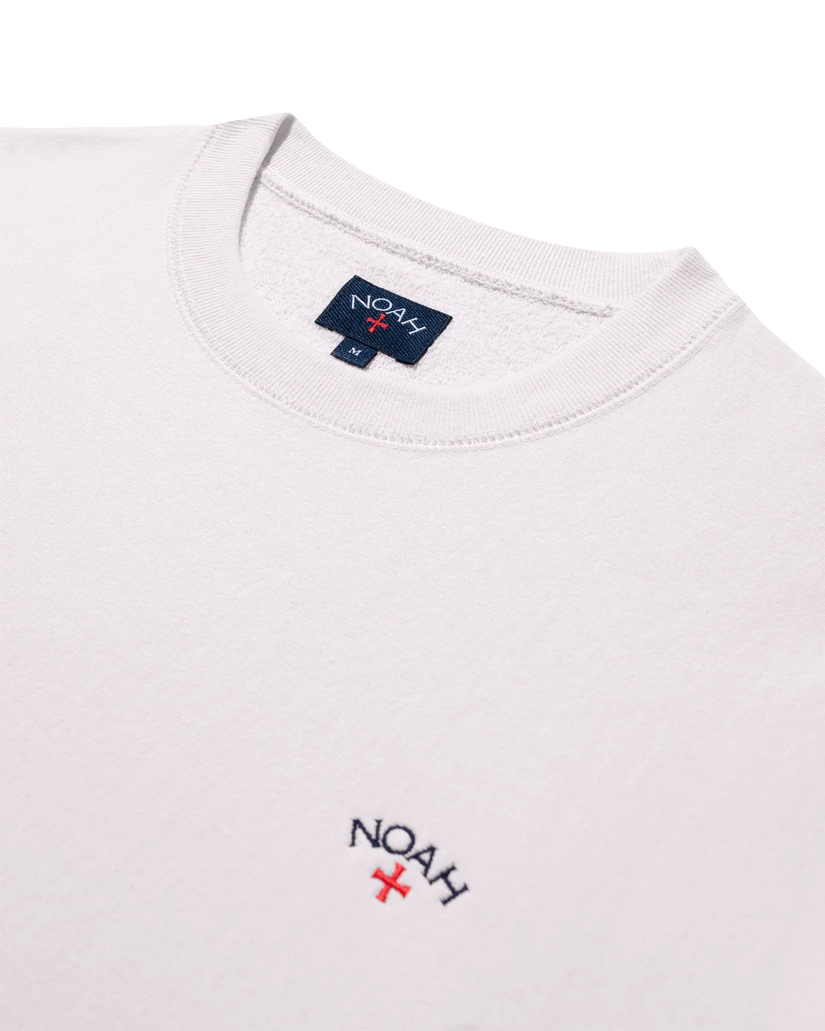 Noah Classic Crewneck Light Pink front view collar detail in a white background