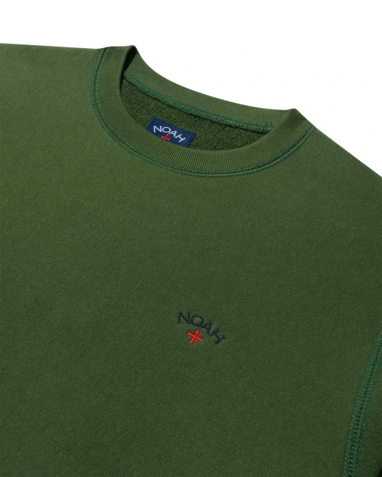 Noah Classic Crewneck Green front view in a white background