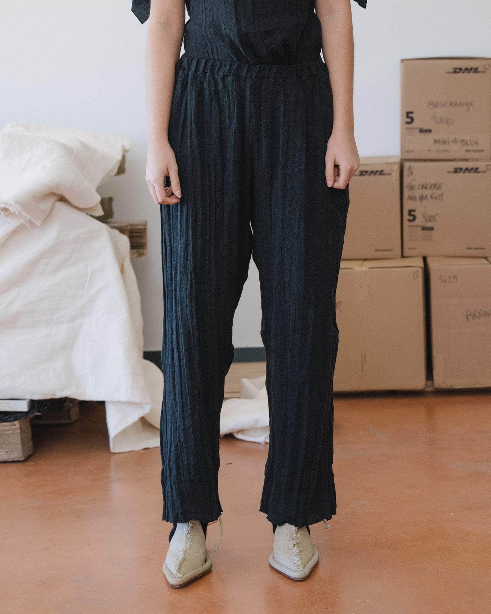 Baserange Folio Pants Black front view on model