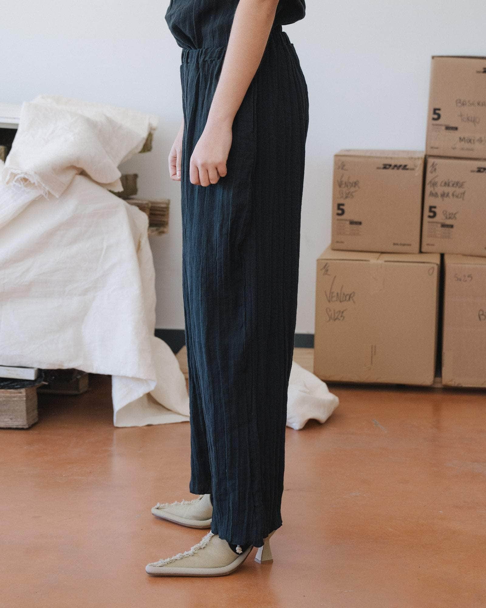 Baserange Folio Pants Black side view on model