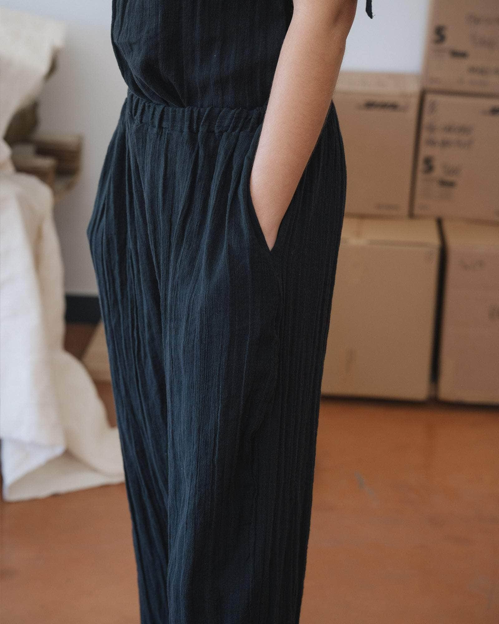 Baserange Folio Pants Black side view on model