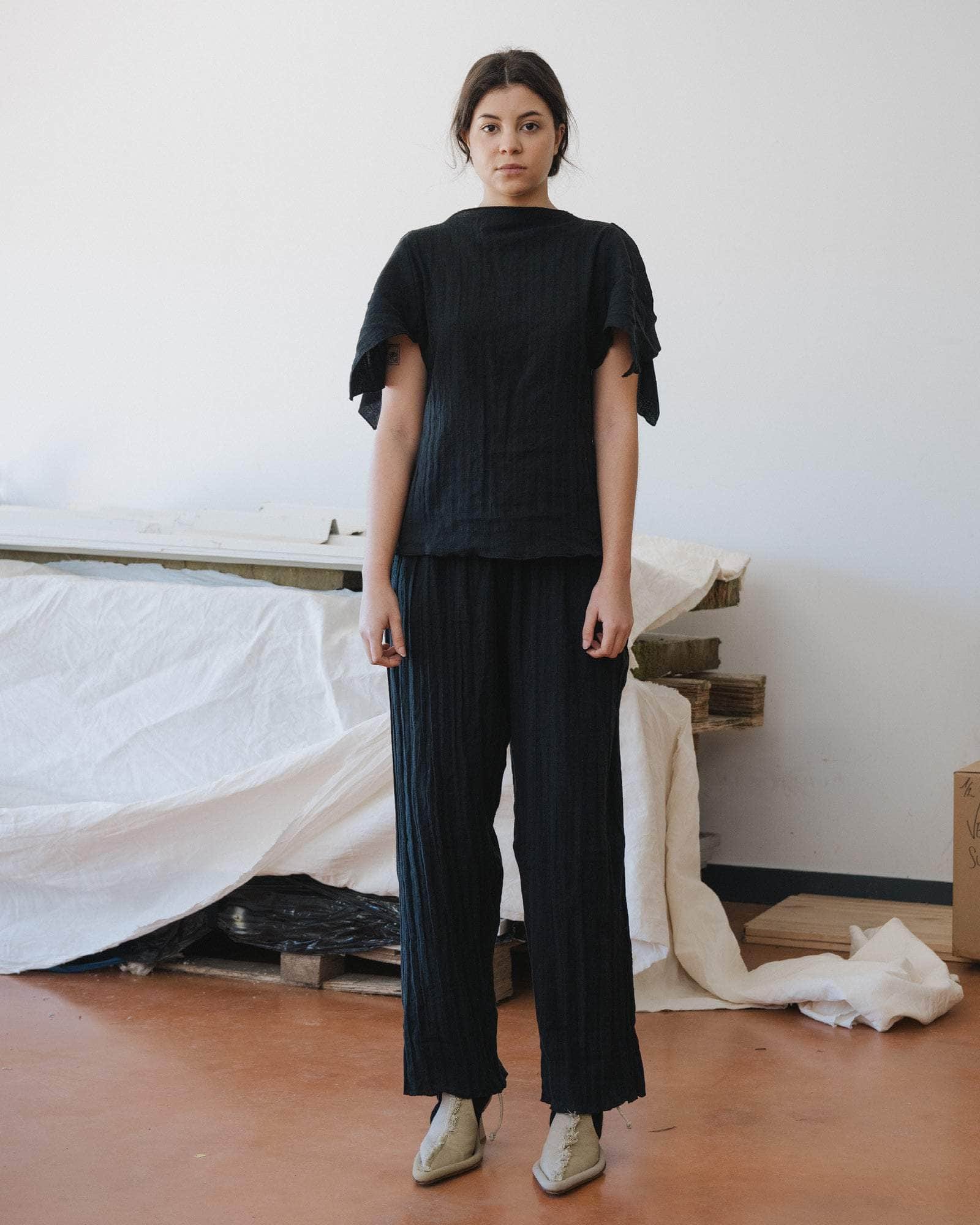 Baserange Folio Pants Black front view on model