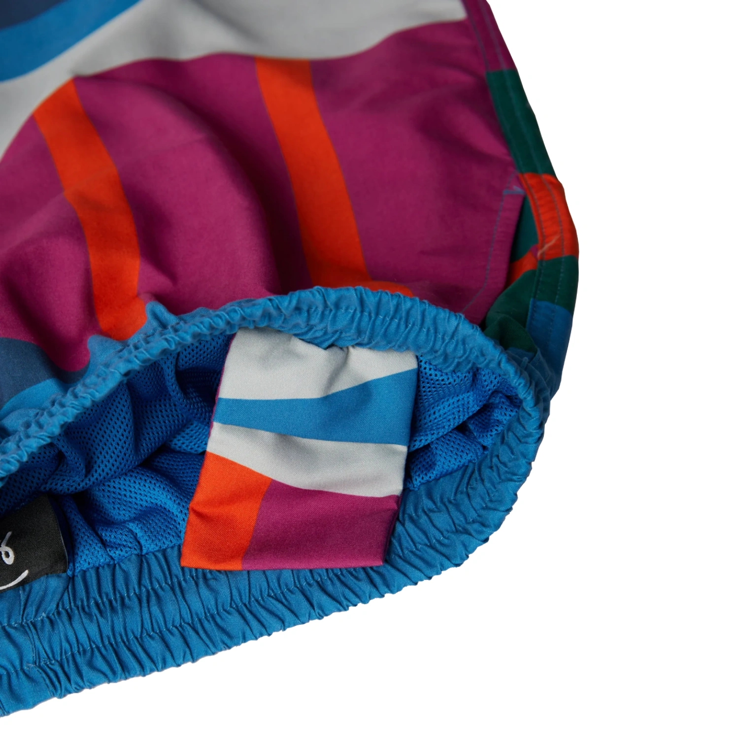 The Festival Fence Swim Shorts inside pocket detail in a white background
