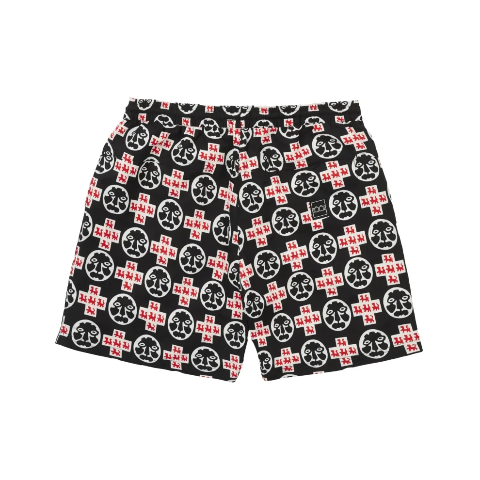 The Trilogy Tapes Crosshead Swimshorts back view in a white background