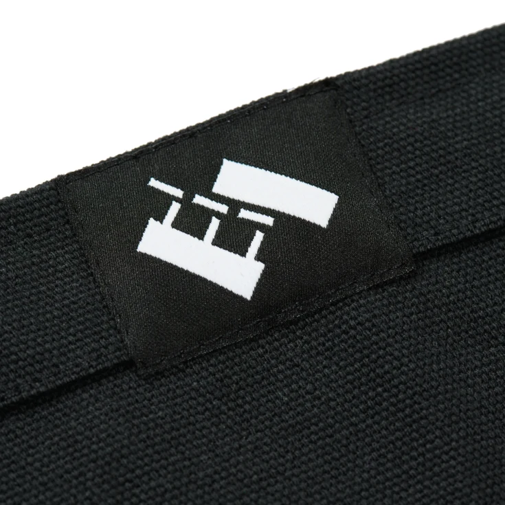 The Trilogy Tapes Heart Tote tag detail in a white background